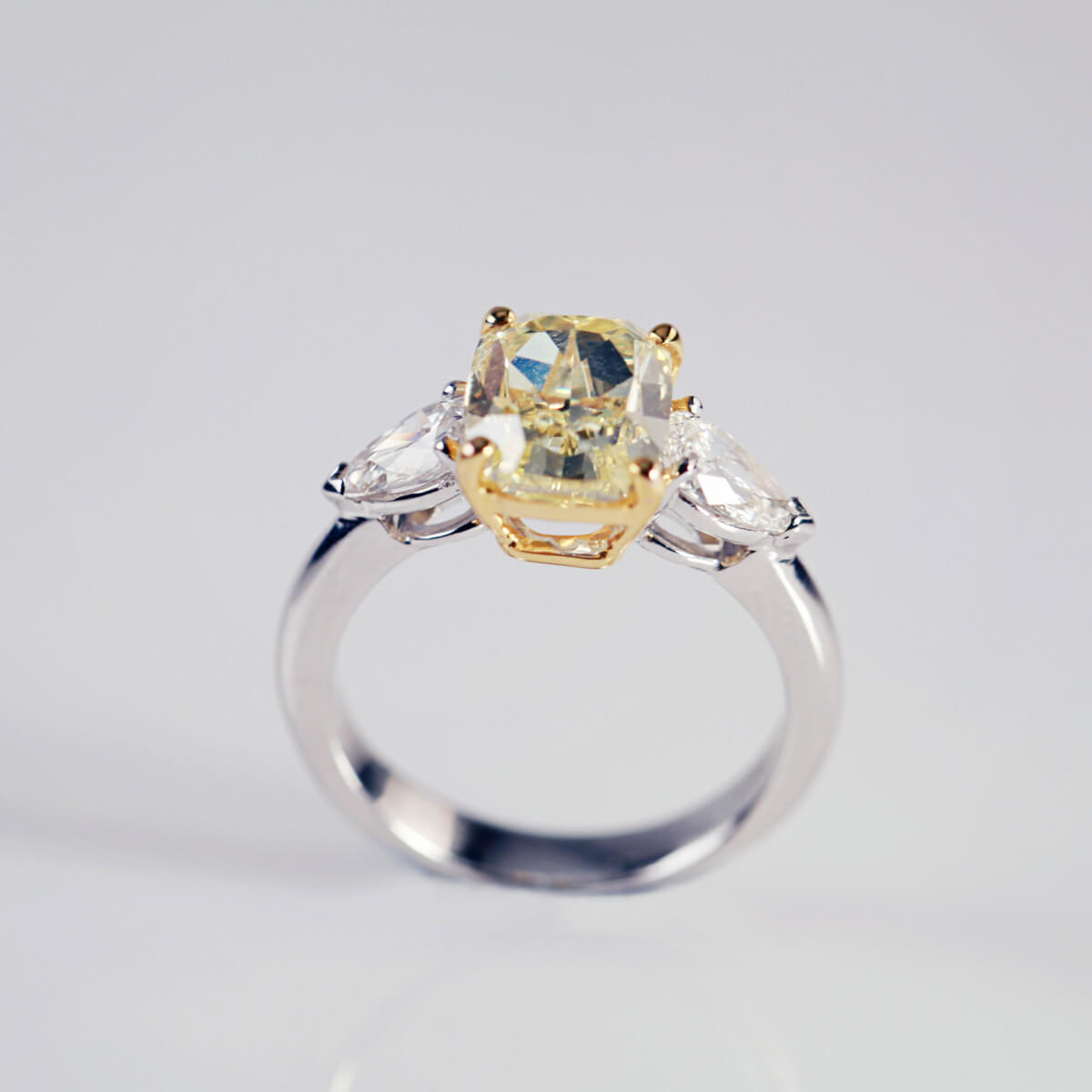 Emerald Cut Yellow Diamond With Pear Shaped Diamond Shoulders